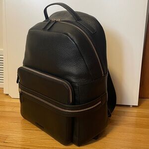 Cole Haan Leather Backpack with gold accents